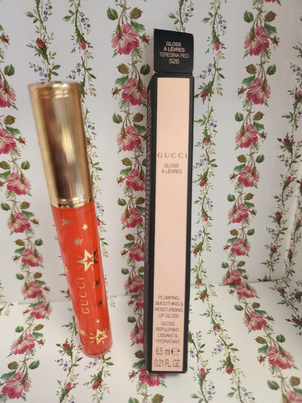Gucci Orange Lip Gloss with Gold Cap and Star Motifs